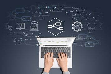 Image of hands typing on laptop working on Node-RED flows